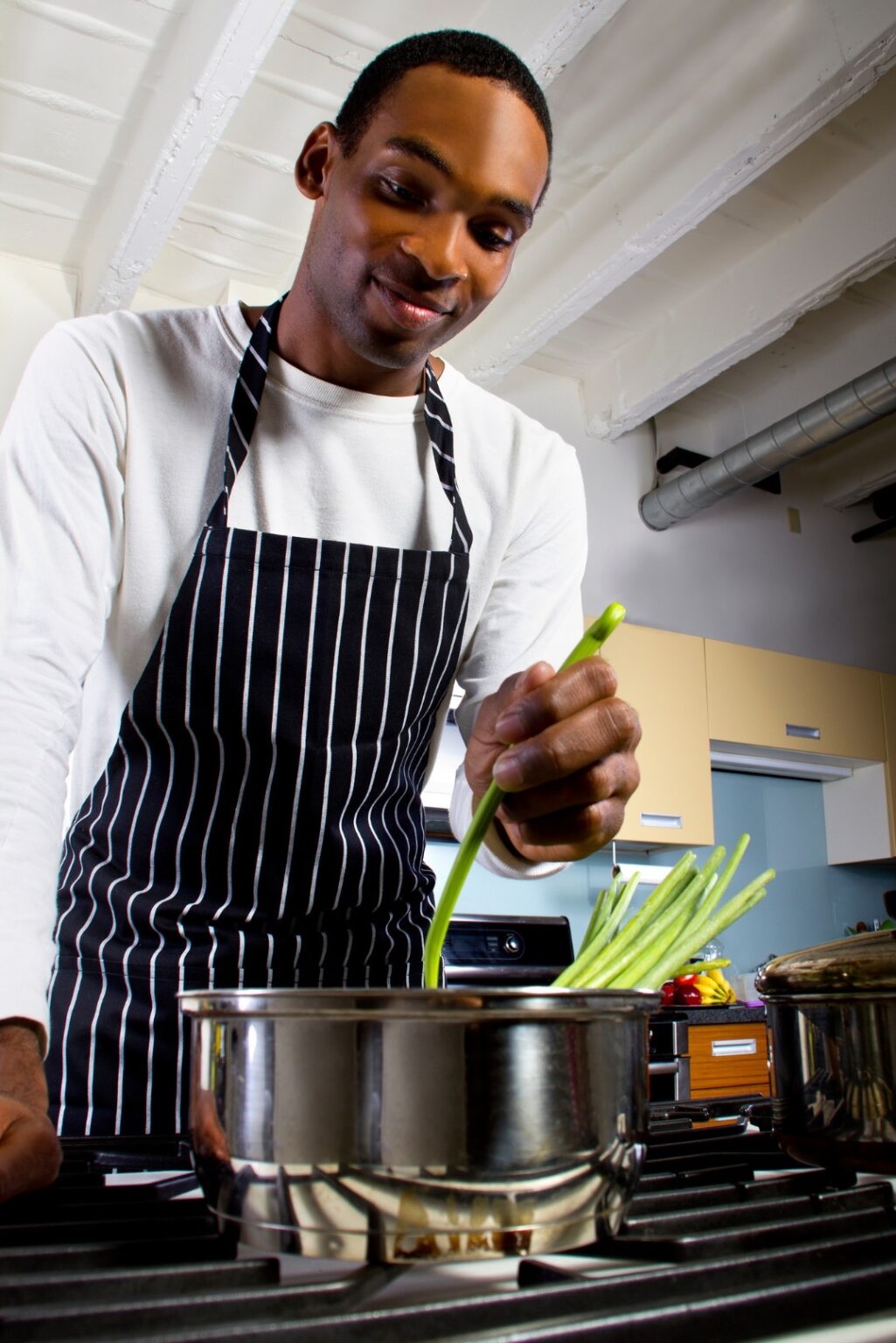 National Food Safety Education Month   Black Man Cooking At Home 1025x1536 